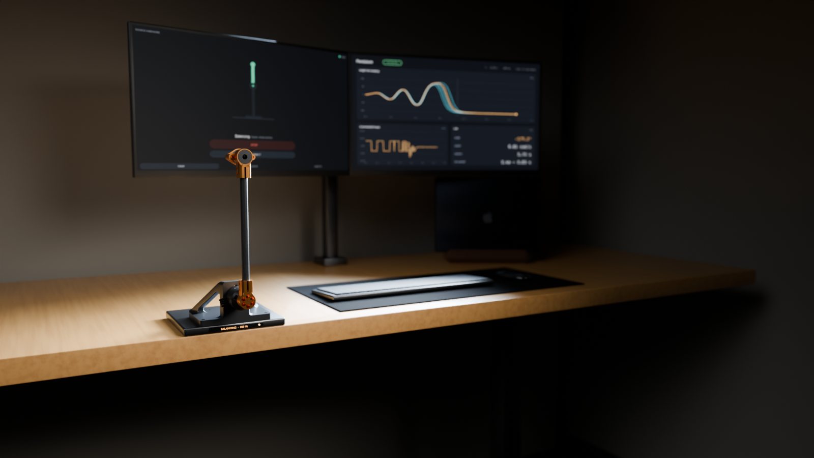 The pendulum balancing at the edge of my desk at night, lit by the two monitors